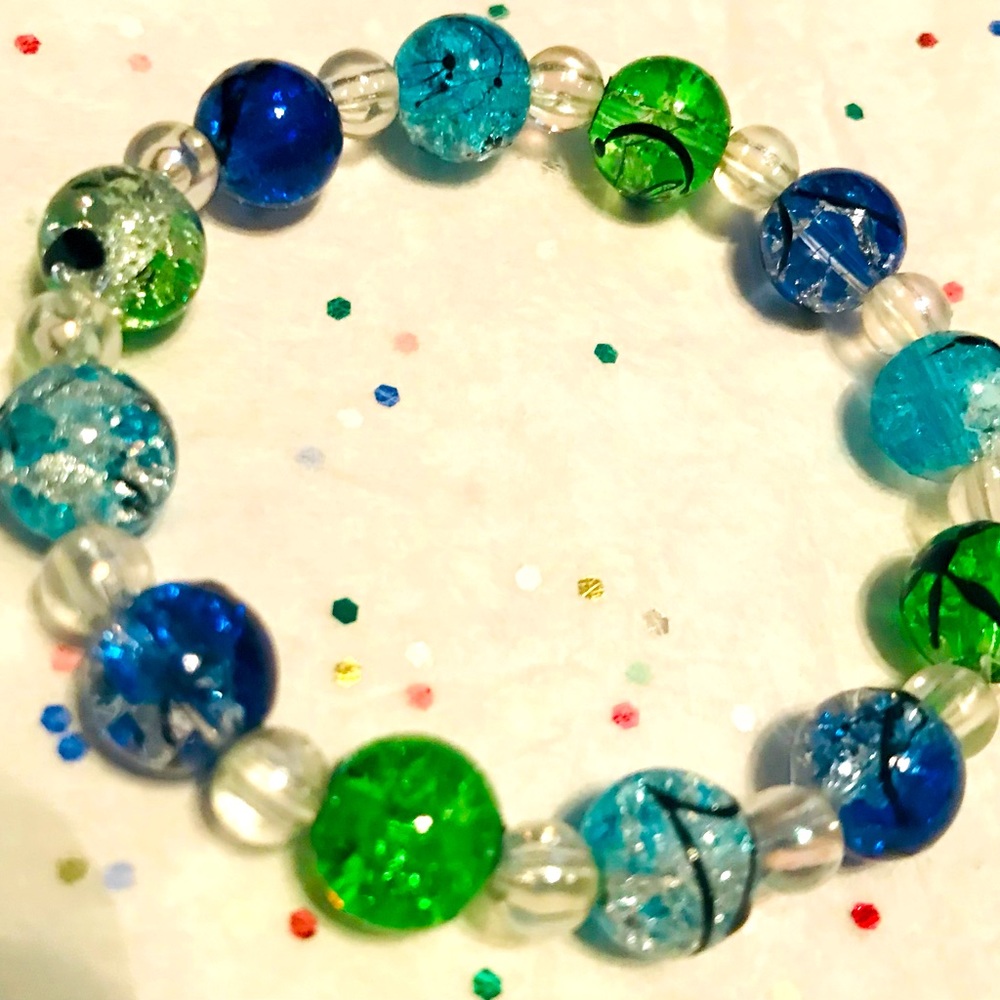 Multicolored hand strung glass beaded bracelets.